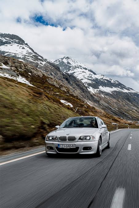 BMW E46 M3 driving on a winding road